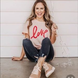 peach with red writing tee